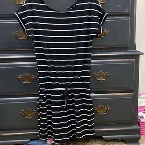 Women’s black romper with white stripes. Size medium.